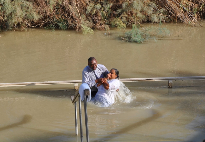 Baptism in the Jordan River. Photo by Leon Mauldin.