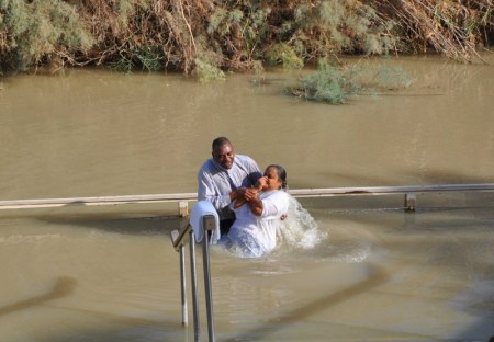 Baptism in the Jordan River. Photo by Leon Mauldin.